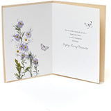 Floral embossed birthday greeting card with glitter accents from UK Greetings, featuring elegant floral design and festive embellishments.