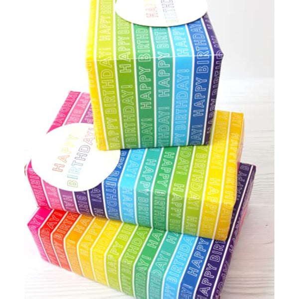 Colorful rainbow stripe gift wrap set featuring matching greeting cards by Abacus Cards, ideal for special occasions and celebrations.