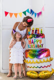 Gold foil birthday cake balloon by Anagram with colorful cake and candle design, perfect for birthday celebrations.