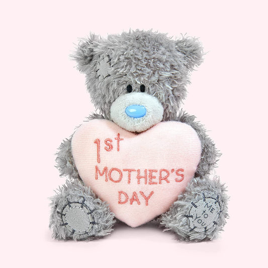 Soft plush Tatty Teddy Bear from Carte Blanche holding a "1st Mother's Day" sign, perfect for celebrating first Mother's Day.