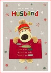 Boofle stood holding a big envelope-Husband (90)
