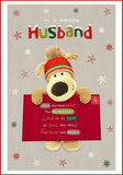 Boofle stood holding a big envelope-Husband (90)
