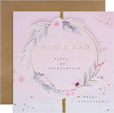 Hallmark anniversary greeting card for mum and dad with contemporary floral text design and colorful floral accents.