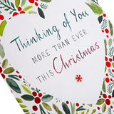Illustrated Hallmark Christmas greeting card with traditional festive design and "Thinking of You" message on the front.