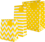 Yellow and white multi-occasion gift bag bundle with greeting cards from Hallmark, featuring cheerful designs for various celebrations.