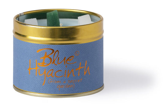 Blue Hyacinth scented tin candle by Lily-Flame with a decorative label and a lit wick, ideal for home fragrance.