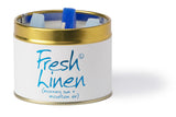 Lily-Flame Fresh Linen scented tin candle with a white label and metal lid, cozy home decor accessory.