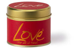 Love Scented Tin Candle by Lily-Flame with a decorative tin container and a lit wick, emitting a warm, inviting glow.
