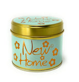Lily-Flame New Home Scented Tin Candle with floral design, featuring a silver tin container and a lit wick for cozy ambiance.