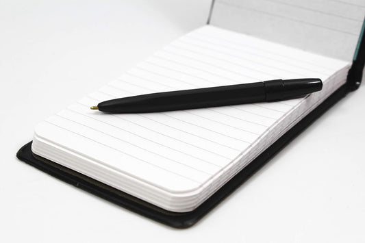 Silvine elasticated pocket notebook with 80 pages, durable PVC covers, and a pen for convenient note-taking.