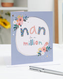 Heartfelt birthday card for Nan with love and warm wishes, featuring colorful floral and heart illustrations from UK Greetings.