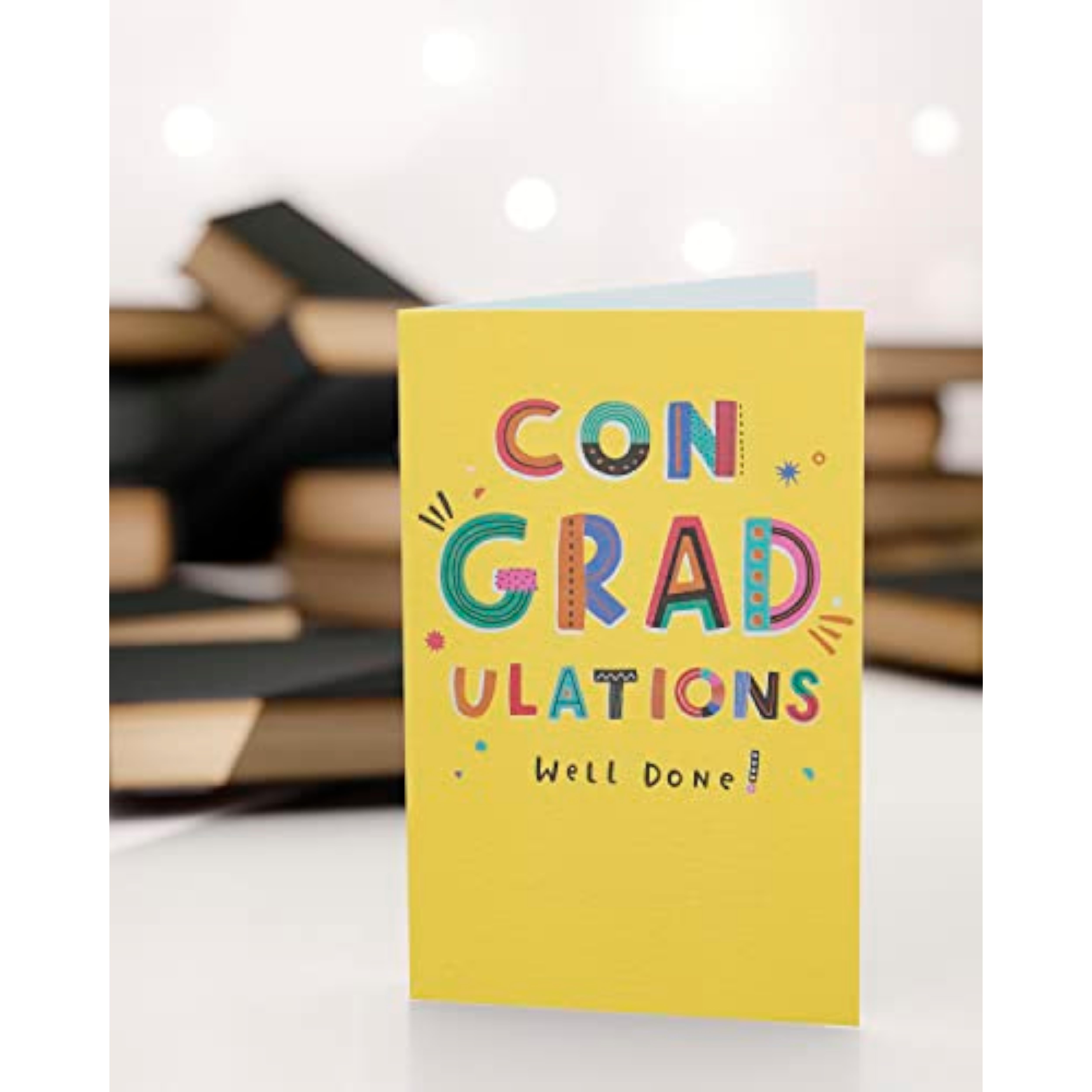 Vibrant yellow graduation card with celebratory design by UK Greetings, perfect for congratulating graduates.