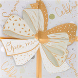 Luxury pop-up money wallet gift card holder with elegant gold bow design, UK Greetings product, featuring a stylish and functional accessory.
