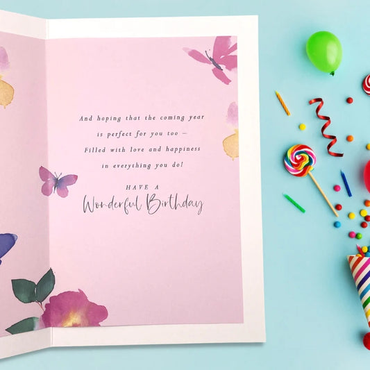 Elegant birthday card featuring colorful butterfly illustrations and heartfelt wishes, designed for special celebrations.