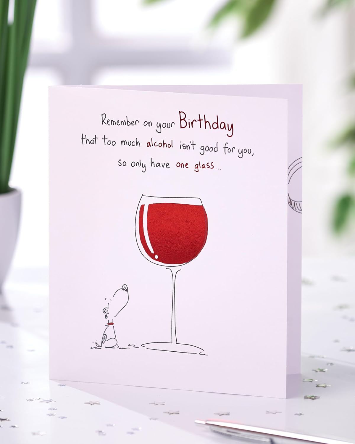 UK Greetings birthday card for her or friend featuring a humorous wine design, ideal for celebrating special occasions.
