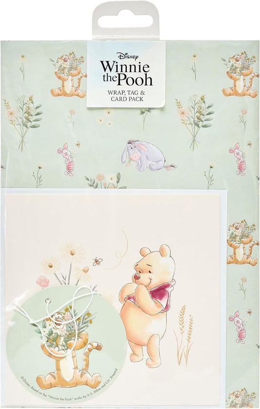 UK Greetings Disney Winnie the Pooh gift wrap, greeting card, and tag pack featuring colorful Pooh-themed designs.