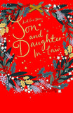 Festive greeting card from UK Greetings featuring a heartfelt message for son and daughter-in-law, with holiday-themed foil design.