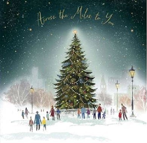 Across the Miles Christmas greeting card by UK Greetings featuring a village tree in the snow scene.