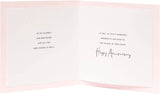 A greeting card from UK Greetings featuring a romantic design for a couple's anniversary celebration.