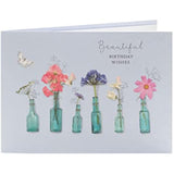 Beautiful floral birthday greeting card by UK Greetings featuring colorful flower illustrations and heartfelt wishes.