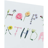 Colorful floral greeting card featuring friendship-themed birthday message from UK Greetings with vibrant floral illustrations.