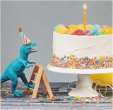Birthday greeting card for him or a friend featuring a colorful cake and dinosaur design by UK Greetings.