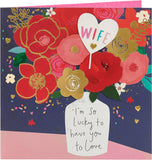 Greeting card for wife featuring a vase bouquet design, UK Greetings birthday card with colorful floral artwork.