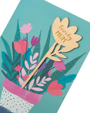 Bright floral Blooming Love Mother's Day greeting card with matching envelope by UK Greetings, featuring colorful flower illustrations.