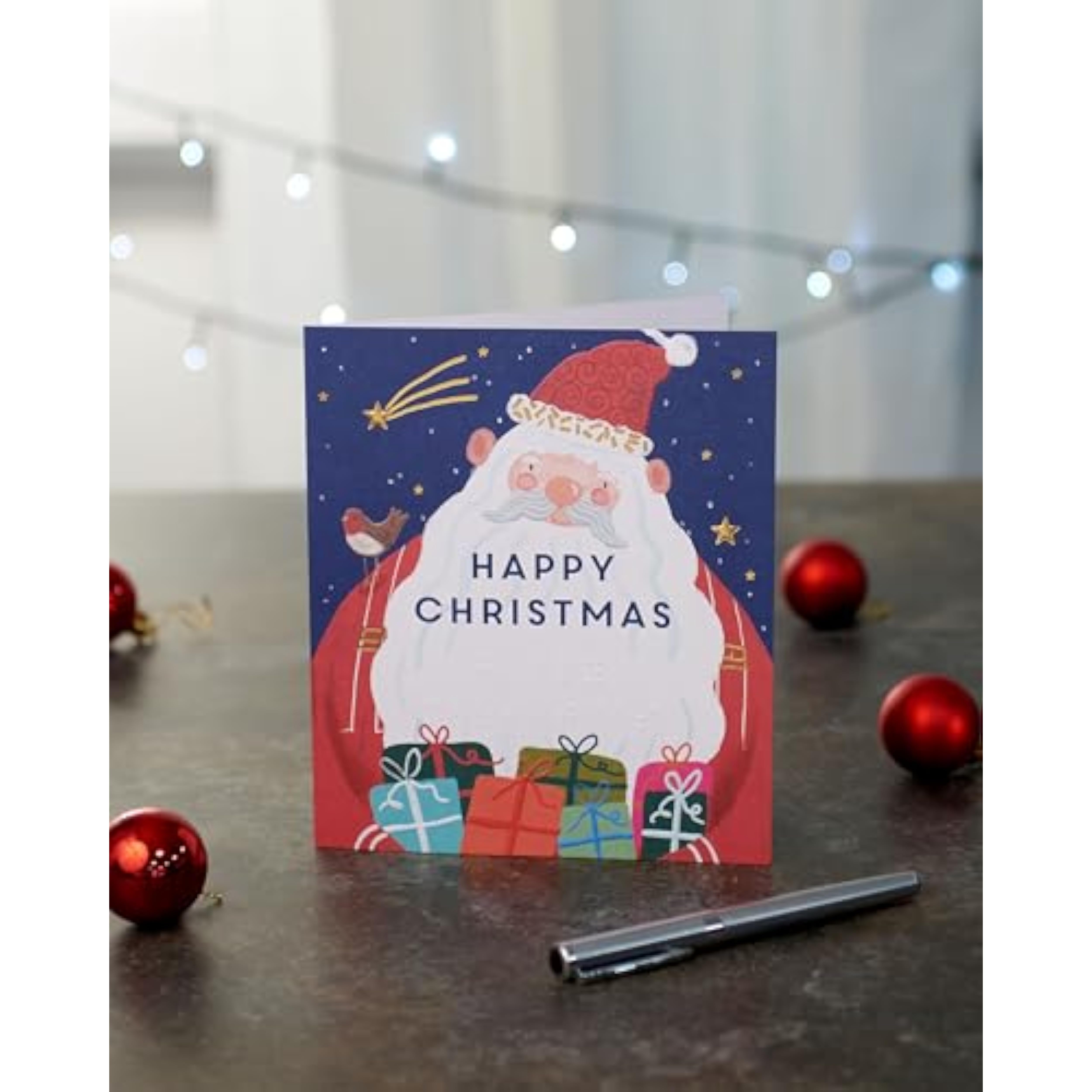Braille Christmas greeting card featuring a festive Santa foil design, created by UK Greetings, with holiday-themed embellishments.