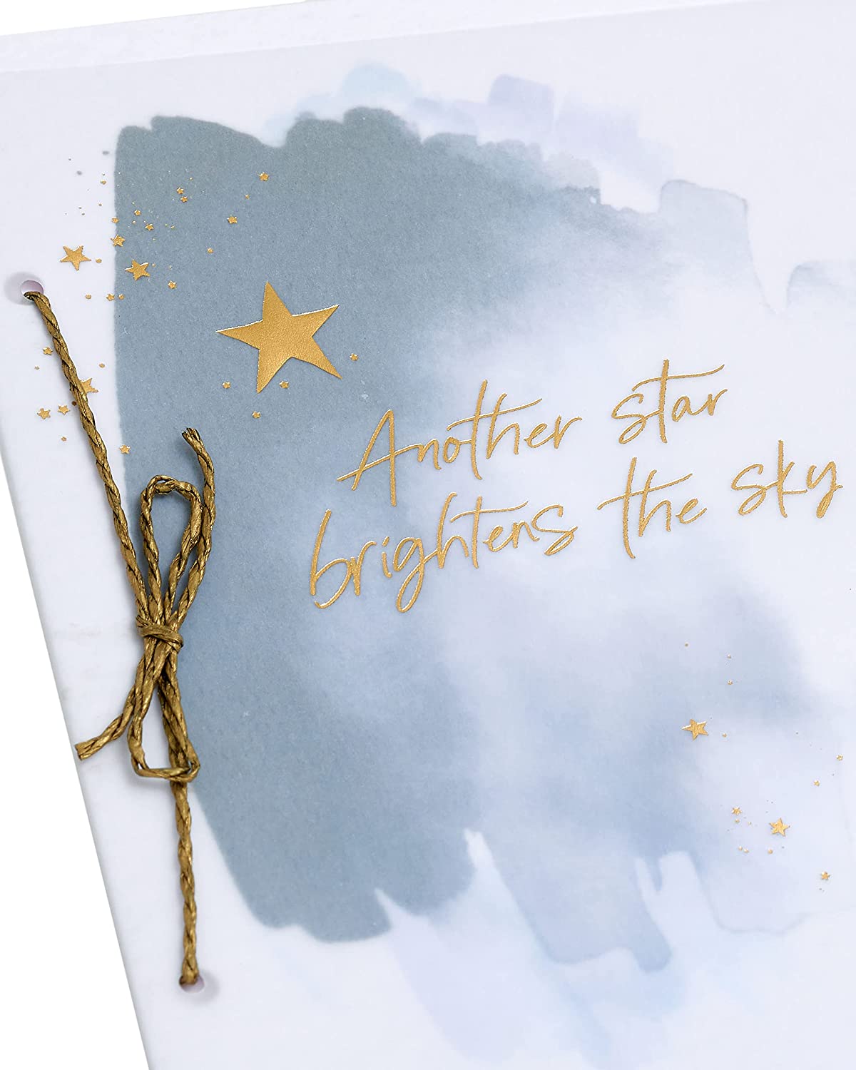 Celestial Gold Star Sympathy Card by UK Greetings featuring a heartfelt design with gold stars and a comforting message.