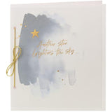 Gold star sympathy greeting card featuring celestial design, from UK Greetings, with heartfelt message for condolence.