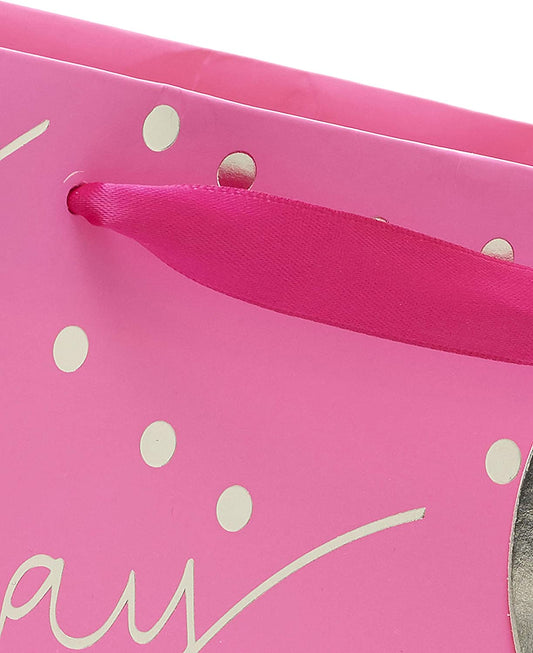 Pink "Happy Birthday" greeting card from UK Greetings featuring cheerful designs, perfect for celebrating special occasions.
