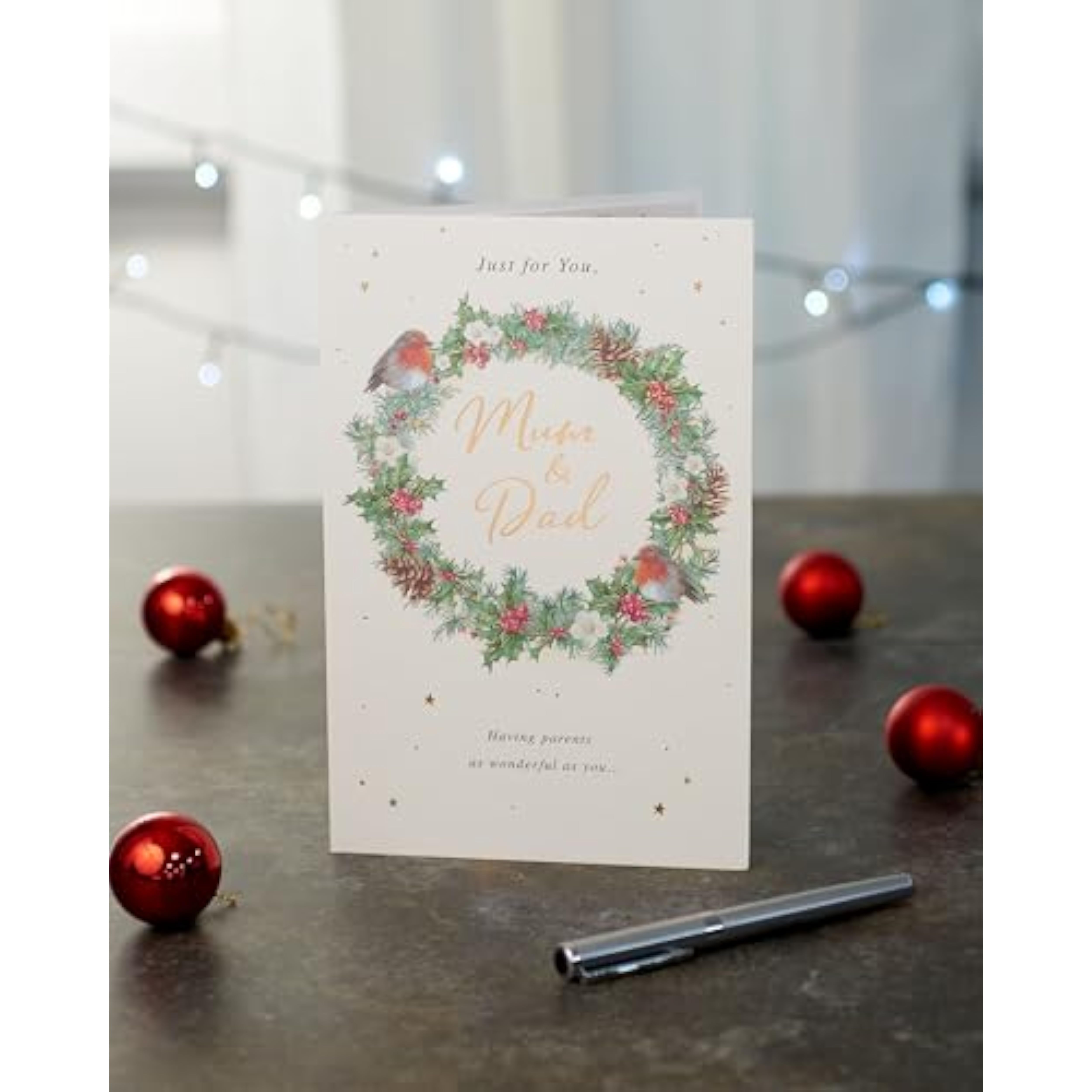 Festive Christmas greeting card for Mum and Dad featuring a foil-designed wreath, UK Greetings, holiday-themed celebration.