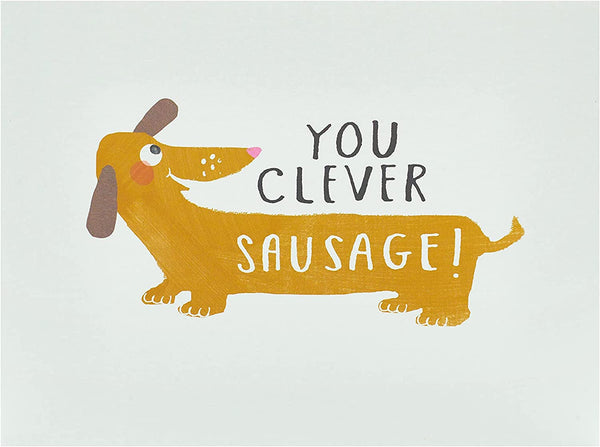 Clever Sausage Congrats Card by UK Greetings featuring humorous sausage illustration and "Well Done You!" message.