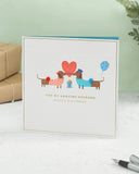 Cute sausage dog husband birthday greeting card featuring adorable dog illustration, perfect for celebrating his special day.