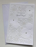 Elegant die-cut pearls anniversary greeting card from UK Greetings featuring a luxurious design for couples.
