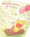 Disney Winnie the Pooh granddaughter 1st birthday greeting card from UK Greetings, featuring Winnie the Pooh and cheerful birthday message.