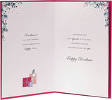 UK Greetings Christmas greeting card featuring a doorway with a festive wreath for son and daughter-in-law.