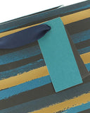 Blue and gold striped gift bag with a greeting card design, featuring elegant patterns and UK Greetings branding.