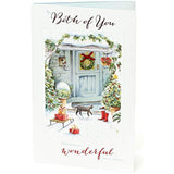 Elegant UK Greetings Christmas greeting card for a couple with glitter accents and a decorative bow, featuring festive holiday design.