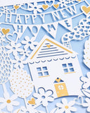 Elegant laser cut New Home Congratulations greeting card by UK Greetings featuring intricate designs and heartfelt message.