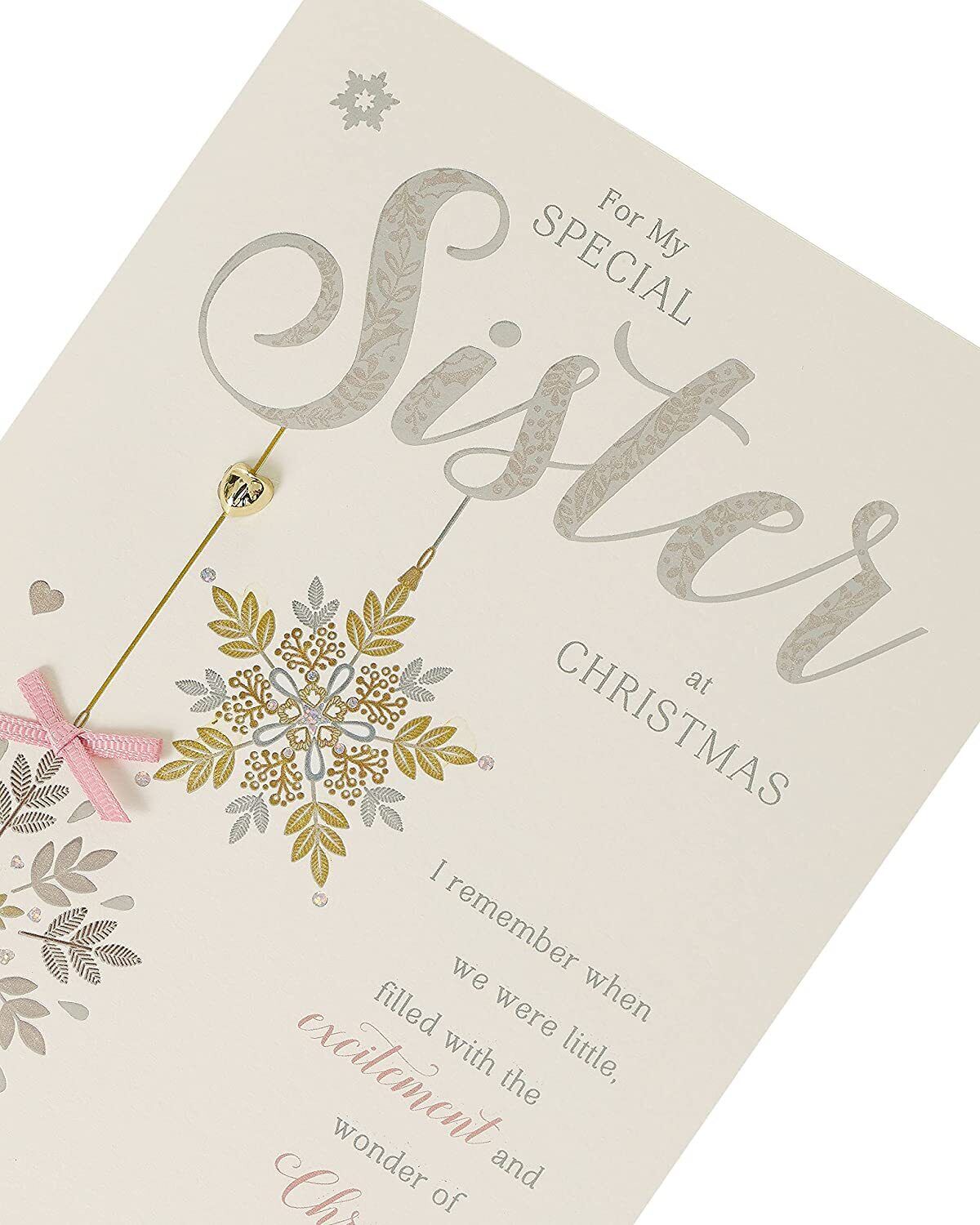 Elegant Stars Christmas greeting card for sister from UK Greetings, featuring festive star designs on the front.