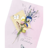 Embossed floral birthday greeting card with meadow design from UK Greetings, featuring colorful flower illustrations.