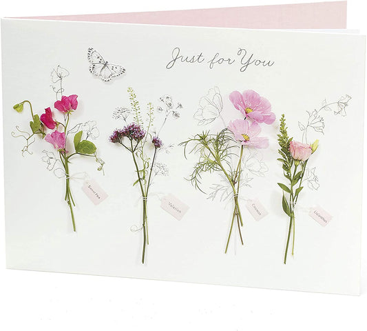 Floral Pretty Birthday Card featuring meadow flowers from UK Greetings, showcasing colorful flower illustrations on the front.