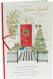 Front door scene Christmas greeting card from UK Greetings, featuring festive holiday decorations for someone special.