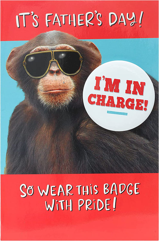 Funny chimp badge on UK Greetings Father's Day greeting card featuring humorous chimp illustration and playful design.