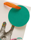 Greeting card featuring a giraffe design, packaged in a gift bag, from UK Greetings with colorful, playful animal artwork.