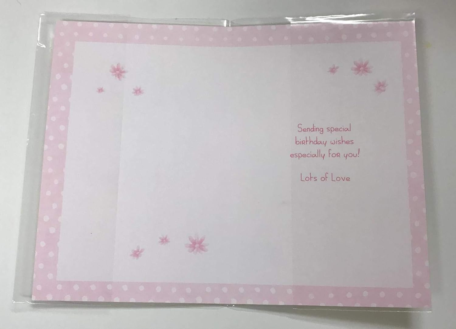 Happy Birthday Nana greeting card featuring a teddy bear design, by UK Greetings, with colorful illustrations and heartfelt message inside.