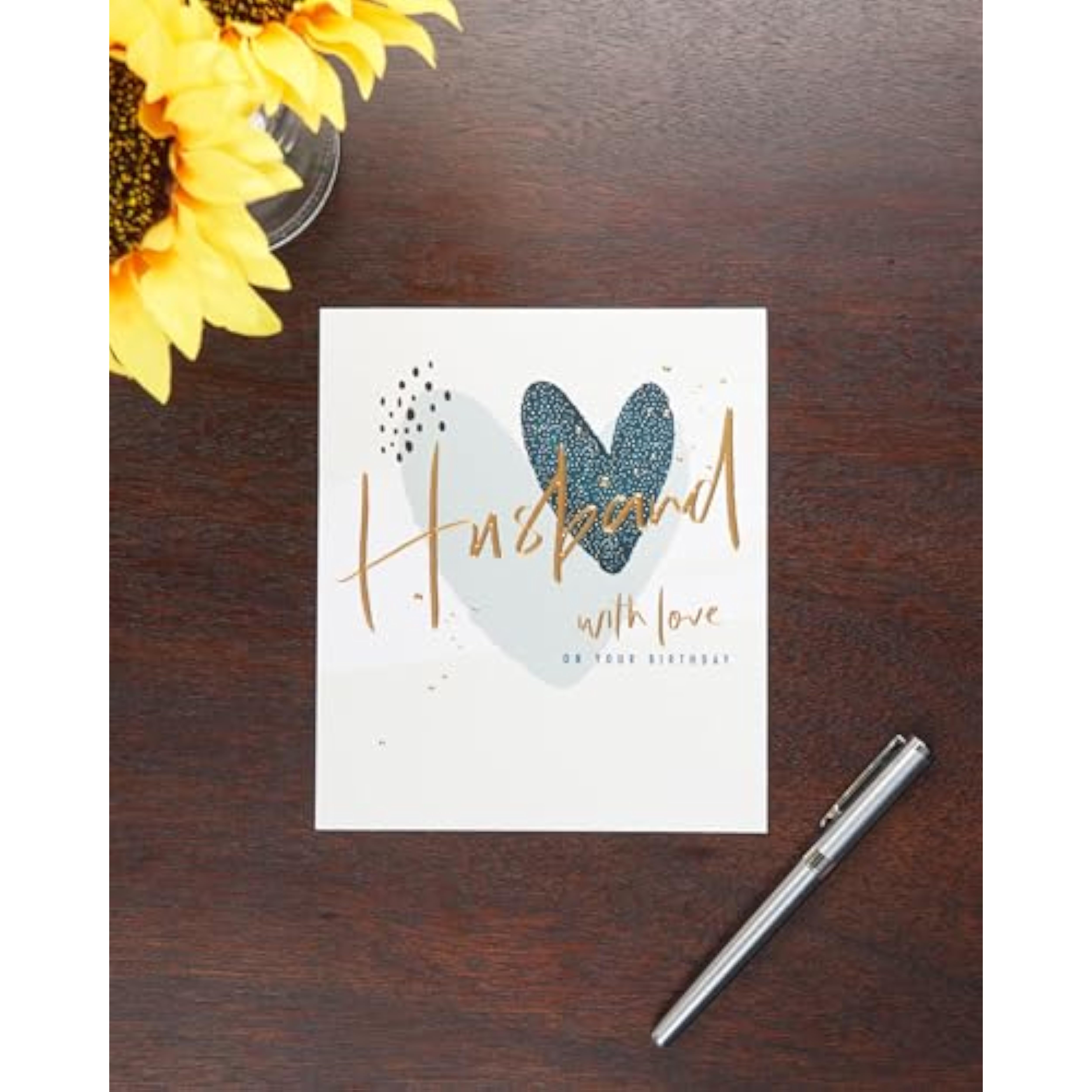 Hearts design husband birthday greeting card from UK Greetings showing a romantic message and decorative hearts.