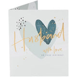 Hearts design husband birthday greeting card from UK Greetings with romantic red heart illustrations and heartfelt message inside.